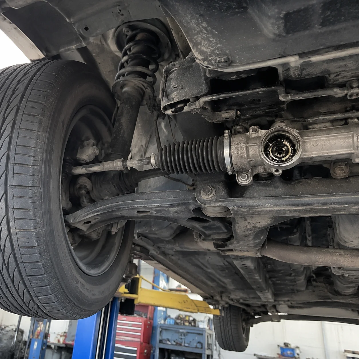 Car suspension and steering system view from under vehicle showing bearing applications